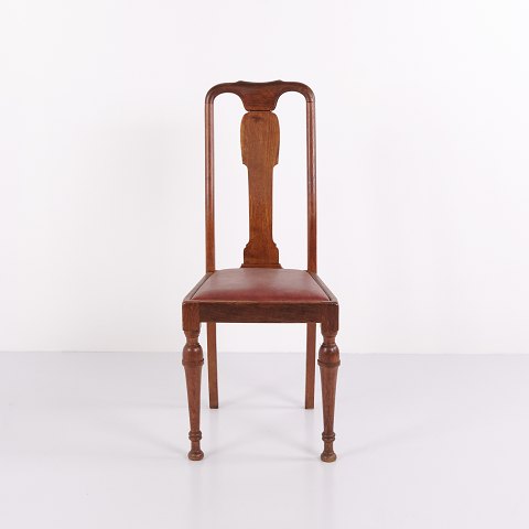 Dining chairs in dark wood and red leather from the 1920s