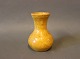 Small ceramic vase with a yellow glaze.
5000m2 showroom.