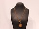 Gilded 925 sterling silver necklace with large pendant by Dyberg Kern.
5000m2 showroom