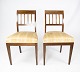 A pair of dining room chairs of mahogany with inlaid wood upholstered with light 
fabric from the 1920s.
5000m2 showroom.
